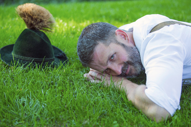 bavarian man lying on the grass - Foto, immagini