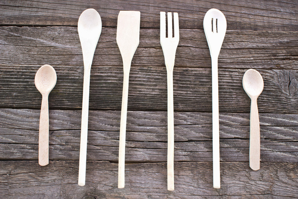 Wooden cutlery set on wooden background - Foto, imagen