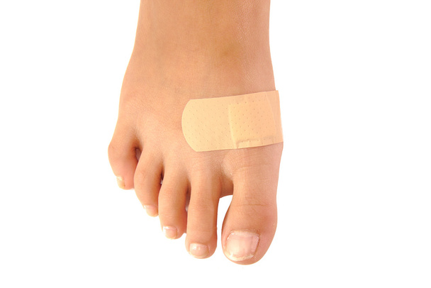 Close up of band-aid on a foot isolated. white background - Photo, Image