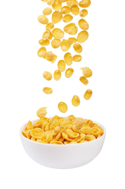 Flocons de maïs tombant dans un bol
 - Photo, image