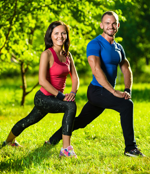 Man and woman doing stretching exercises - Photo, Image