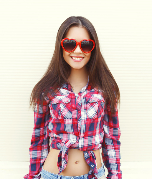 Portrait of pretty young woman in the red sunglasses having fun  - Fotografie, Obrázek