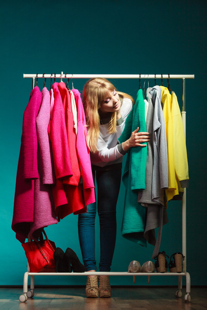 Woman choosing clothes - Fotó, kép