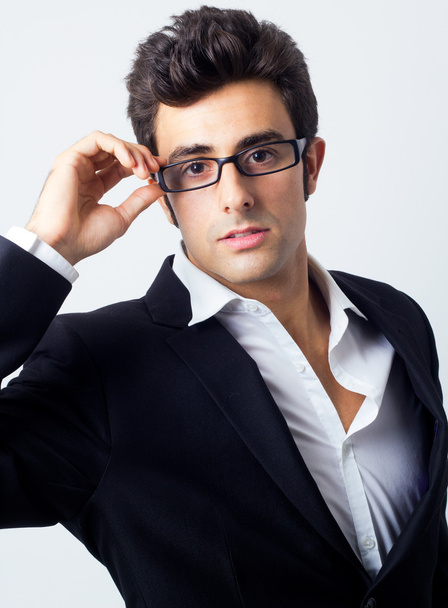 Expressive businessman in black suit and glasses - Fotografie, Obrázek