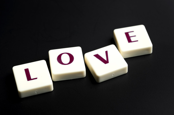 Love word made by letter pieces - Фото, зображення