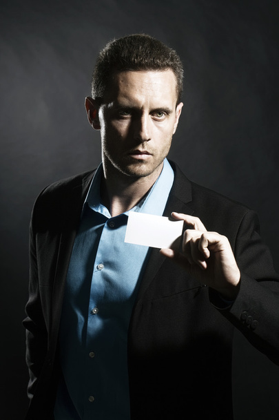Serious man with card - Photo, image