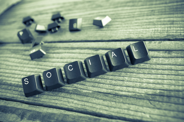 "social "wrote with keyboard keys on wooden background, green vi
 - Фото, изображение