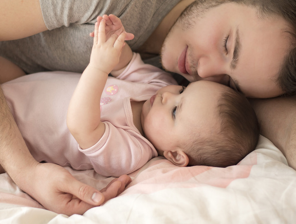 father sleeping with baby daughter - Photo, image