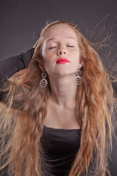 Red-haired girl with red lips - Фото, зображення