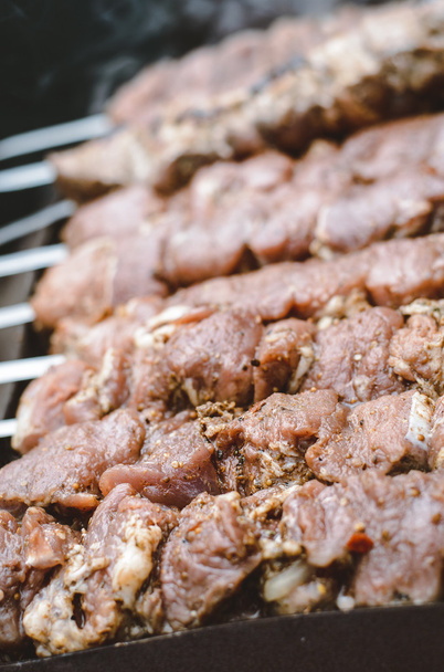 Fresh meat on outdoor grill  - Фото, зображення