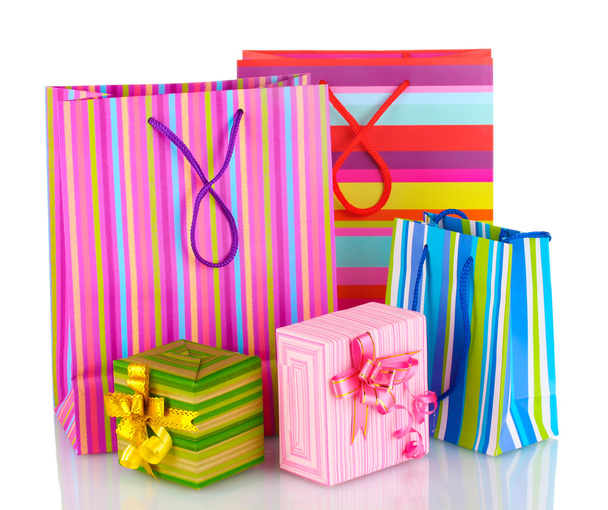 Bright gift bags and gifts isolated on white - Фото, зображення