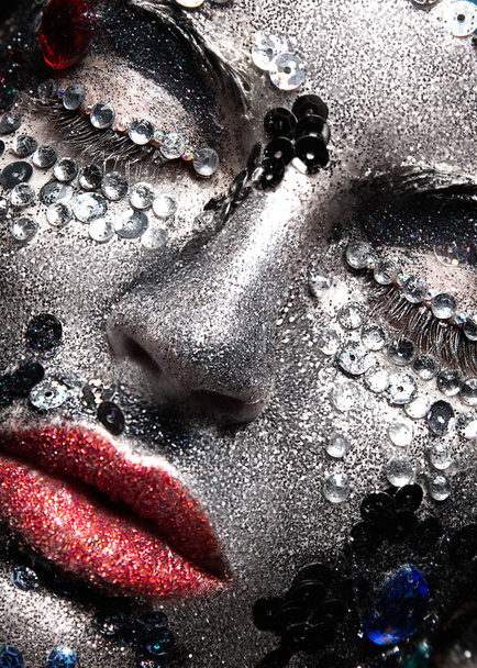 Girl with glitter and rhinestones on her face. Beauty close-up.  - Photo, Image