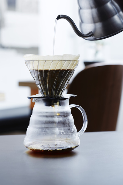 Pouring hot water into coffee - Фото, зображення