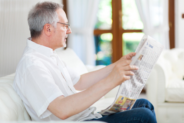 man reading a newspaper - Фото, изображение