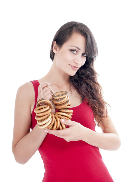 Woman  with a bunch of bagels - Photo, image