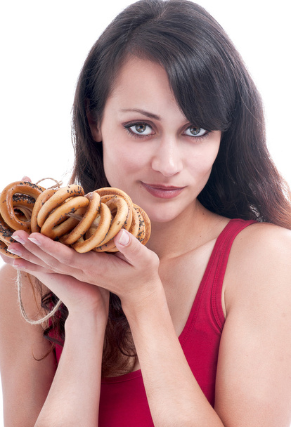 Woman  with a bunch of bagels - Photo, image