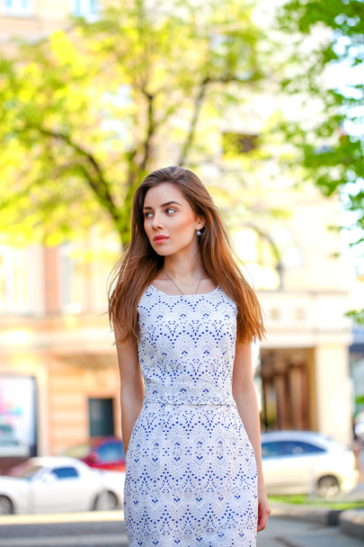Young beautiful woman in white dress - Foto, Imagen
