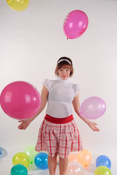 Cute young girl with balloons - Фото, зображення