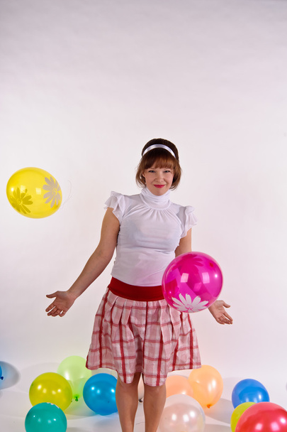 Cute young girl with balloons - Фото, зображення