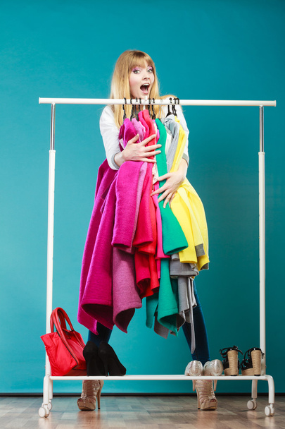 woman taking all clothes wardrobe - Fotó, kép