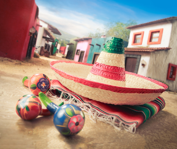 Mexican hat on a "serape" in  village - Photo, Image