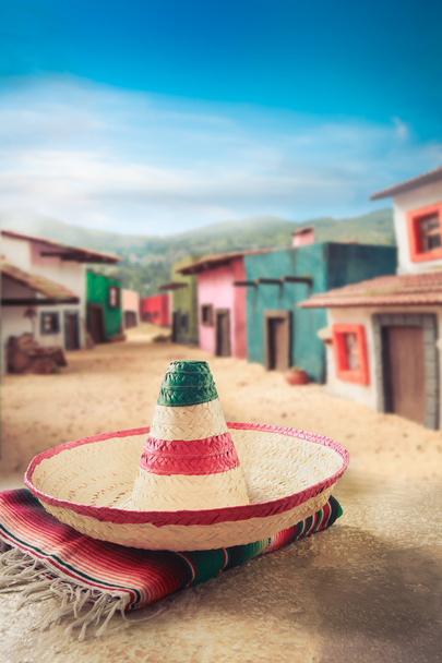 Mexican hat on a "serape" in  village - Photo, Image