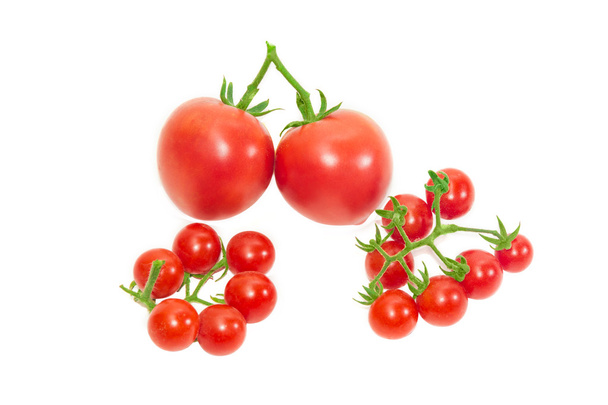 Two branches of cherry tomato and two conventional tomatoes - Photo, Image