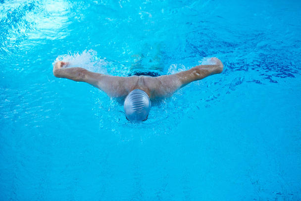 swimmer in indoor swimming pool - Fotó, kép
