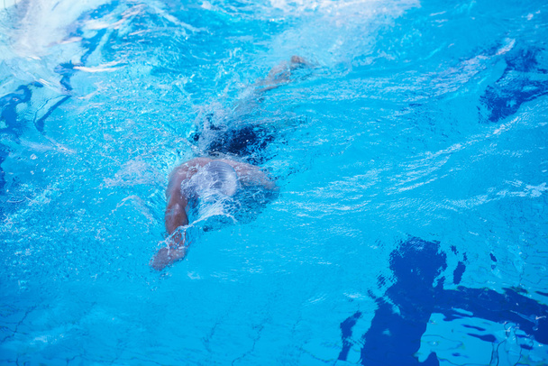 swimmer in indoor swimming pool - Фото, зображення