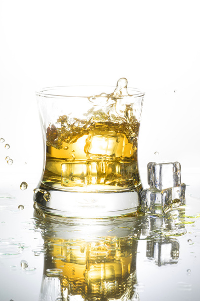 Whisky splash isolated on a white background - Photo, Image