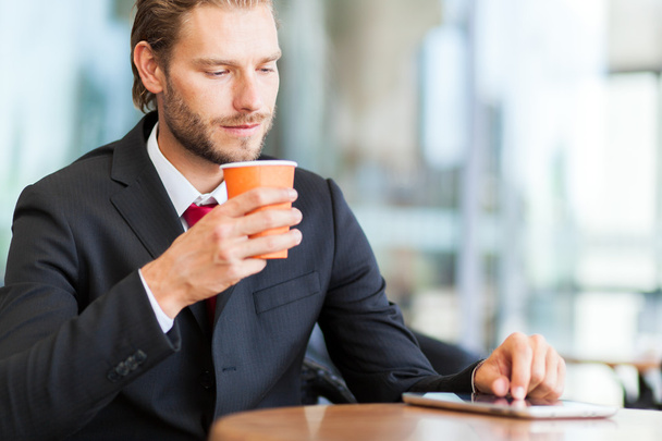 businessman looking his tablet - Photo, image