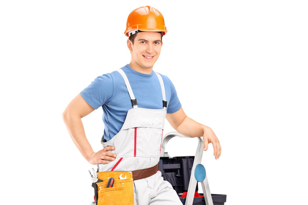 Male electrician standing on a ladder - Zdjęcie, obraz
