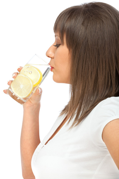 Woman drinking water with lemon - Fotó, kép