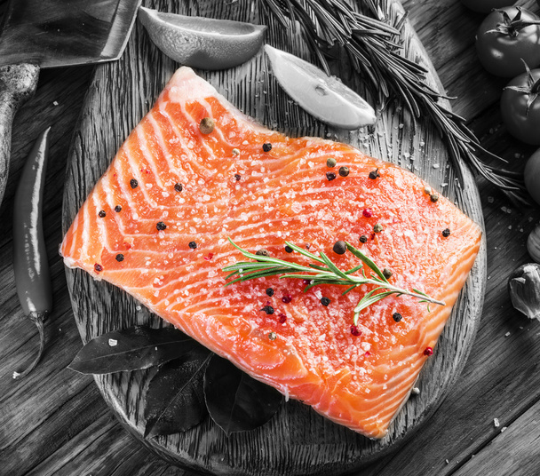 Fresh salmon on the cutting board. - Фото, зображення