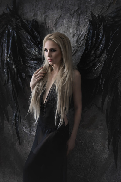 blond woman  with black wings - Foto, Imagem