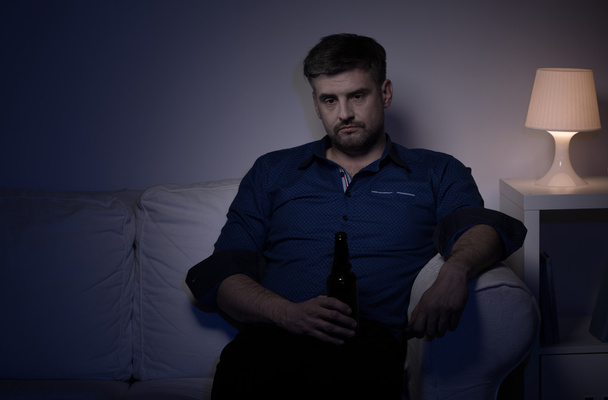 Wretched man with beer - Foto, afbeelding