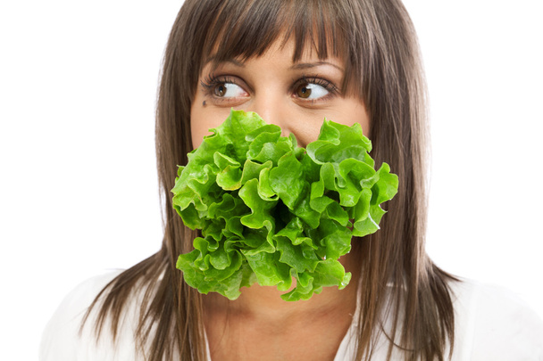 Young woman eating fresh salad - Fotografie, Obrázek
