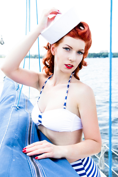 Attractive woman in swimsuit on yacht - Φωτογραφία, εικόνα