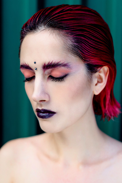 Attractive young woman with colorful makeup - Foto, immagini