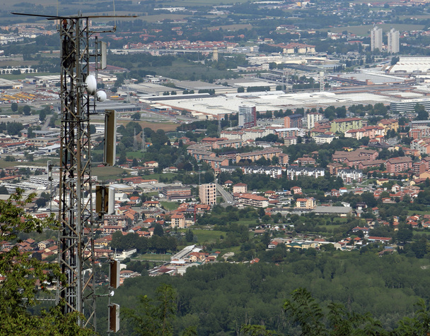 wireless telecommunications antenna over the immense metropolis - Photo, Image
