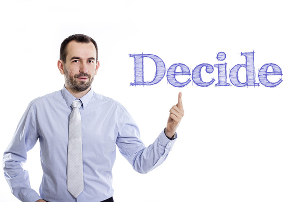 Rozhodnutí - mladý podnikatel s malou bradkou směřující nahoru v modré košili - Fotografie, Obrázek