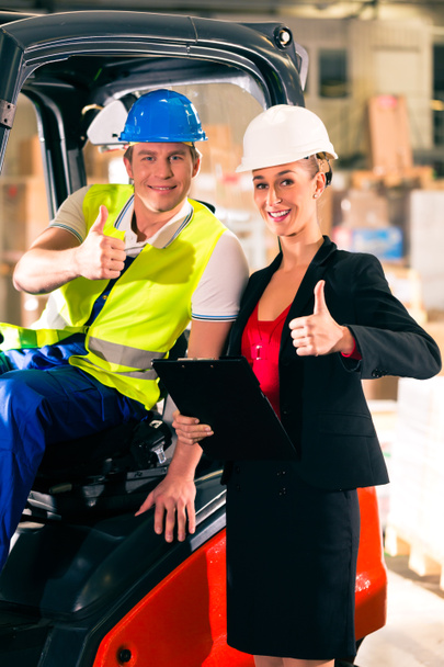 Forklift driver and supervisor at warehouse - Photo, Image