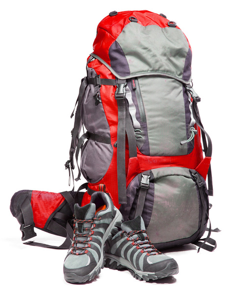 Hiking shoes and packed backpack on white background - Zdjęcie, obraz