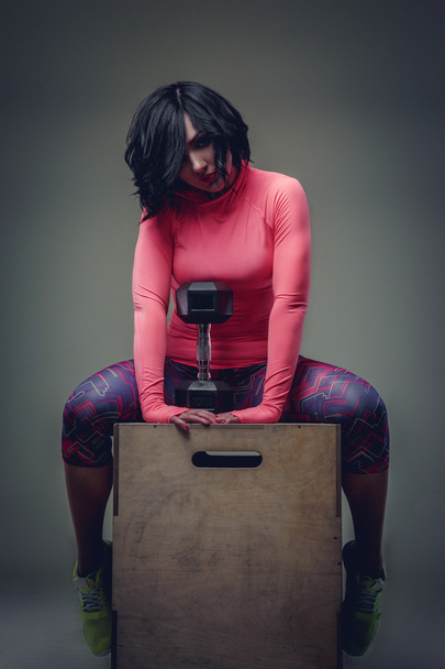 Awesome brunette woman in colorful sportswear. - Foto, Bild