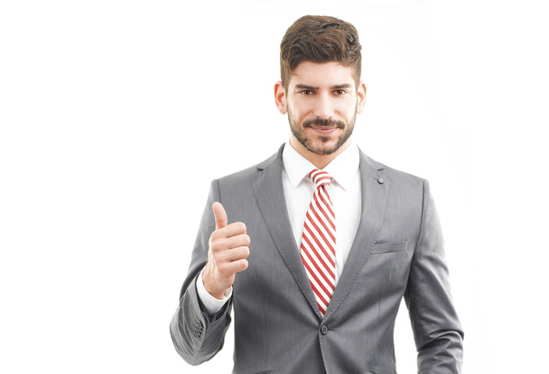 Successful businessman gesturing thumb up - Photo, Image