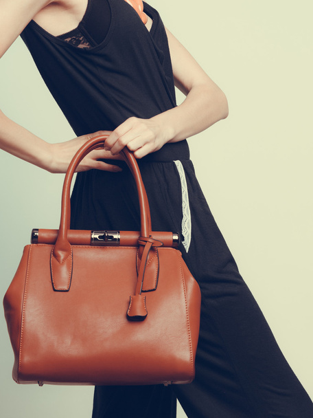 woman with leather handbag - Фото, зображення