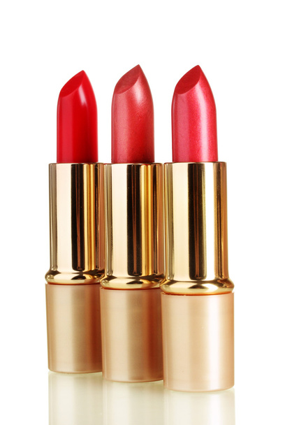 Beautiful red lipsticks isolated on white - 写真・画像