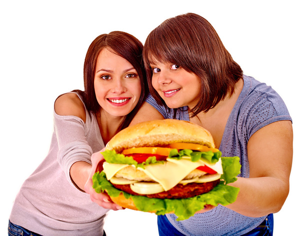 Hamburger yiyen kadınlar. - Fotoğraf, Görsel