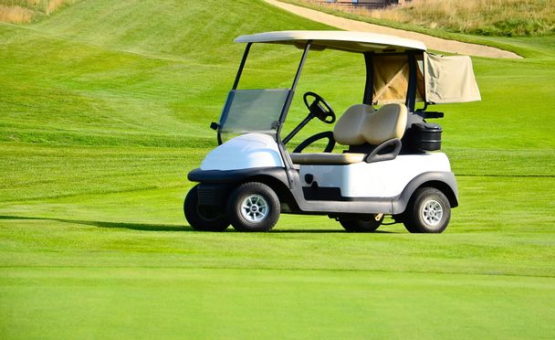 Golf cart on a golf course - Фото, изображение