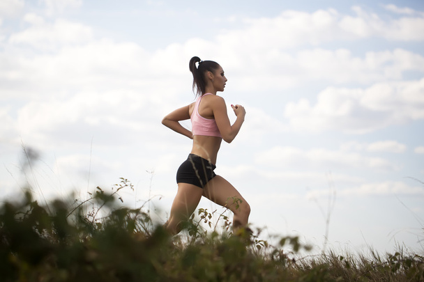 Pretty woman running - Фото, изображение